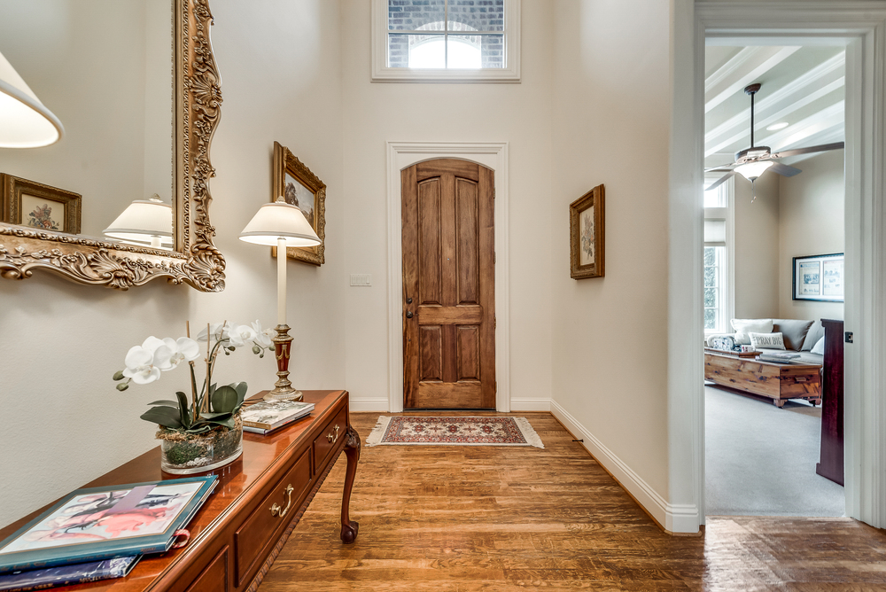    Entry with Soaring Ceilings Hardwood Floors and Gorgeous   ft Door 