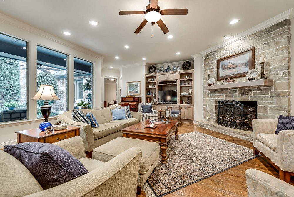    Spacious Family Room with Stone Fireplace and Built In Entertainment Center 
