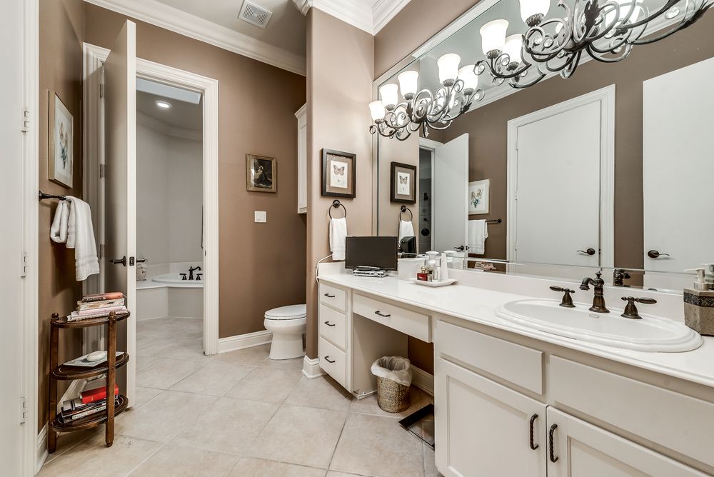    Master Bath has His   Hers Bathrooms and Separate Jetted Tub and Shower Area 