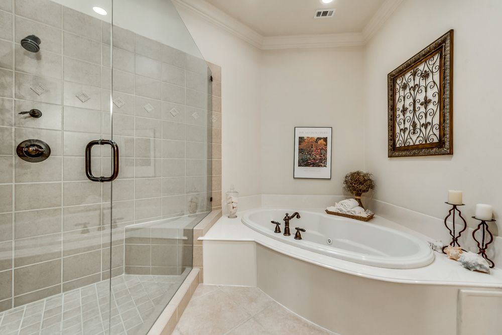    Master Bath has His   Hers Bathrooms and Separate Jetted Tub and Shower Area 
