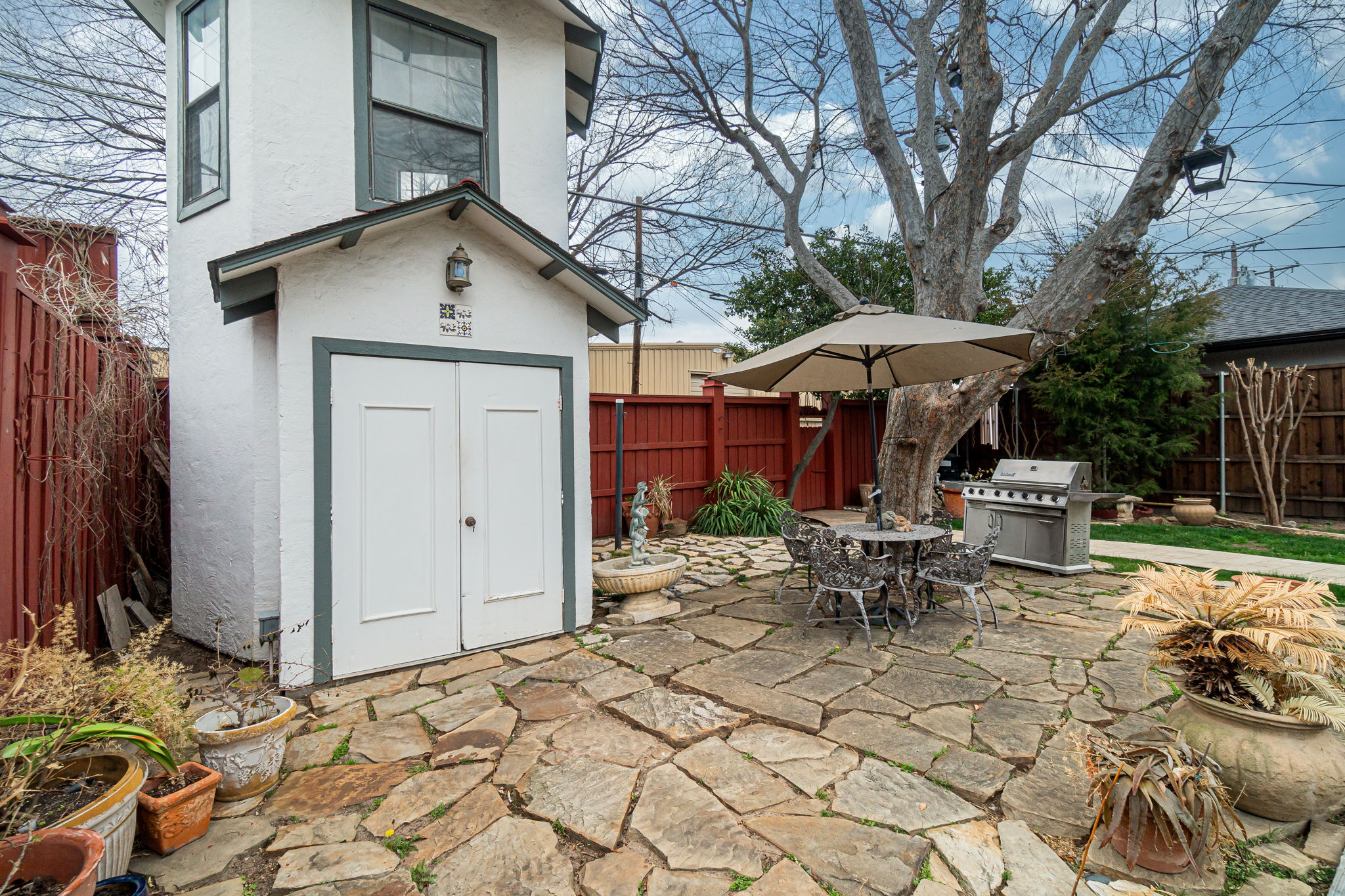    Open Flagstone Patio and Storage Building 