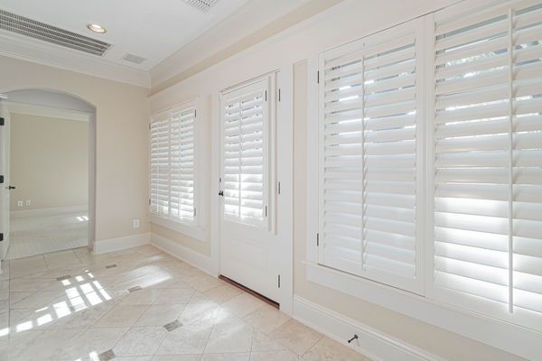    Entry with Travertine Floors and Plantation Shutters 