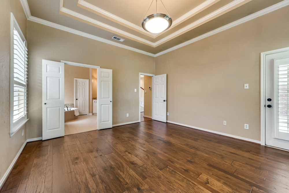    Master Suite With Hardwoods and Double Tray Ceiling 