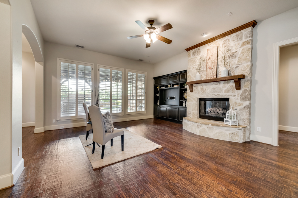    Inviting Family Room offers Stone Gas Log Fireplace and Built In Entertainment Center 